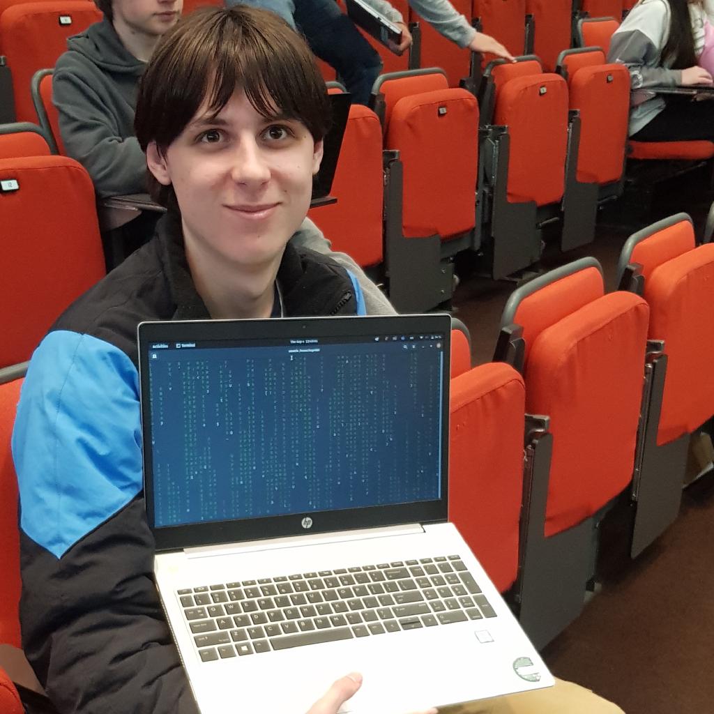 Attendee displaying laptop with the terminal open running the cmatrix command.